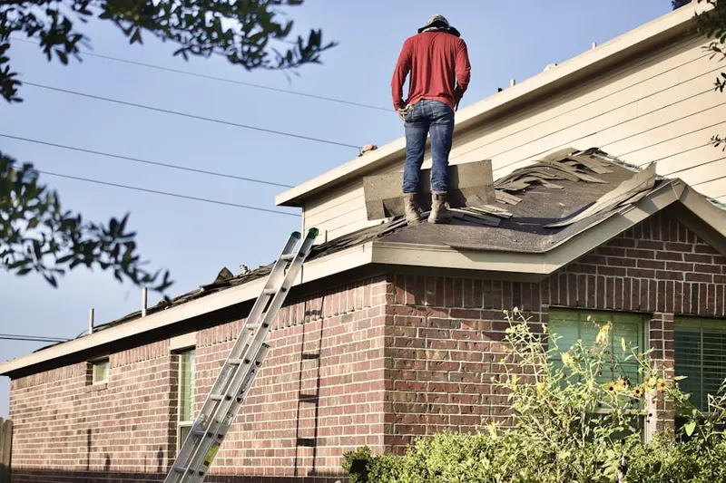 Professional roofer working on a residential roof in Stateline